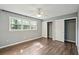 Cozy bedroom featuring wood floors, window, a ceiling fan and closet at 620 Clearview Dr, Charleston, SC 29412