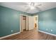 Bedroom featuring hardwood floors, a ceiling fan, and attached bathroom at 620 Clearview Dr, Charleston, SC 29412