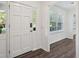 Bright entryway featuring a white door and hardwood flooring that leads into the home's interior at 620 Clearview Dr, Charleston, SC 29412