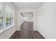 Clean hallway with wood floors, white walls, and natural light coming through the window at 620 Clearview Dr, Charleston, SC 29412