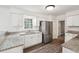 Bright kitchen featuring white cabinets, stainless steel appliances, and granite countertops at 620 Clearview Dr, Charleston, SC 29412