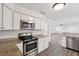 Stainless steel oven and microwave surrounded by granite countertops and white cabinets at 620 Clearview Dr, Charleston, SC 29412