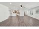 Open-concept layout with new flooring connecting the living area to the modern kitchen at 620 Clearview Dr, Charleston, SC 29412