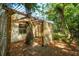 Exterior of an outdoor storage shed with a wooden beam frame and surrounding trees and greenery at 620 Clearview Dr, Charleston, SC 29412