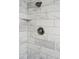 Stylish shower featuring brushed nickel hardware and white subway tile with gray veining at 620 Clearview Dr, Charleston, SC 29412