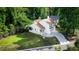 Aerial view of the home with a manicured lawn and long driveway at 675 Fair Spring Dr, Charleston, SC 29414