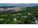 Stunning aerial view showcasing lush community, waterfront access, and convenient clubhouse with pool at 675 Fair Spring Dr, Charleston, SC 29414
