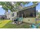 Backyard featuring a patio, grill, seating, and a view of the house at 675 Fair Spring Dr, Charleston, SC 29414