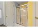 Bathroom featuring a glass-enclosed shower and white doors, ensuring a modern clean look at 675 Fair Spring Dr, Charleston, SC 29414