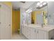 Bathroom showcasing a double sink vanity and a large mirror with decorative lighting at 675 Fair Spring Dr, Charleston, SC 29414