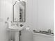 Cozy bathroom showcasing a pedestal sink and a wall-mounted mirror at 675 Fair Spring Dr, Charleston, SC 29414
