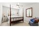 Bedroom with a four-poster bed, side table, and rocking chair at 675 Fair Spring Dr, Charleston, SC 29414