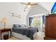 Bedroom showcasing a comfortable bed, large window, and stylish ceiling fan at 675 Fair Spring Dr, Charleston, SC 29414