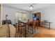 Elegant dining room featuring hardwood floors, a large wooden table, and classic decor at 675 Fair Spring Dr, Charleston, SC 29414