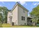 Exterior view of the house featuring a well-maintained yard and screened porch at 675 Fair Spring Dr, Charleston, SC 29414