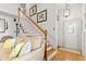 Inviting foyer with hardwood floors, staircase, and ample natural light, creating a warm and welcoming entry point at 675 Fair Spring Dr, Charleston, SC 29414