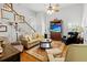 Spacious living area with hardwood floors, ceiling fan, comfortable seating, creating an inviting and cozy atmosphere at 675 Fair Spring Dr, Charleston, SC 29414