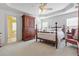 Spacious main bedroom with tray ceilings, soft carpet, and elegant furniture at 675 Fair Spring Dr, Charleston, SC 29414