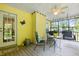 Covered patio with chairs and ceiling fan, perfect for outdoor relaxation at 675 Fair Spring Dr, Charleston, SC 29414