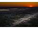 Scenic aerial view showcasing a city at sunset, highlighting its landscape, buildings, and transportation network at 706 White Oak Dr, Charleston, SC 29407