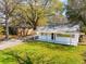 Aerial view of a charming single-story home with well-maintained lawn and mature trees at 706 White Oak Dr, Charleston, SC 29407
