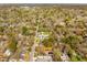 Aerial perspective of a neighborhood with tree-lined streets and a mix of residential homes at 706 White Oak Dr, Charleston, SC 29407