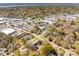 Aerial shot showcasing a neighborhood blending residential and commercial spaces with plentiful parking and green trees at 706 White Oak Dr, Charleston, SC 29407