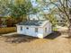 Aerial view of backyard showing landscaping, foliage, and gravel parking at 706 White Oak Dr, Charleston, SC 29407