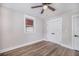 Well-lit bedroom with wood-look floors and double door closet for ample storage at 706 White Oak Dr, Charleston, SC 29407