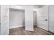 Spacious walk-in closet featuring ample shelving and convenient wood-look floors at 706 White Oak Dr, Charleston, SC 29407