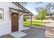 Inviting home entrance featuring a covered porch and a stylish wood door at 706 White Oak Dr, Charleston, SC 29407