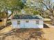 View of the home's backyard featuring mature trees and a well-maintained exterior at 706 White Oak Dr, Charleston, SC 29407