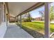 Spacious covered front porch with white columns and view of the lush front yard at 706 White Oak Dr, Charleston, SC 29407