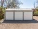 Exterior front view of garage with three bays at 706 White Oak Dr, Charleston, SC 29407