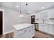 Bright kitchen featuring white cabinets, stainless steel appliances, and an island at 706 White Oak Dr, Charleston, SC 29407
