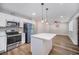 Bright and open kitchen featuring white cabinets, an island, and modern appliances at 706 White Oak Dr, Charleston, SC 29407