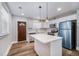 Modern kitchen with white cabinets, an island, and stainless steel appliances at 706 White Oak Dr, Charleston, SC 29407