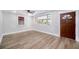 Bright living room with light wood flooring, modern ceiling fan, and ample natural light at 706 White Oak Dr, Charleston, SC 29407
