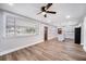 Open-concept living space with hardwood floors connecting to the kitchen at 706 White Oak Dr, Charleston, SC 29407