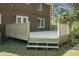 Backyard deck area, perfect for outdoor relaxation and entertaining, features new wood construction at 710 S Magnolia St, Summerville, SC 29483