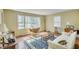 Bright living room features large windows, hardwood floors, and comfortable seating at 710 S Magnolia St, Summerville, SC 29483