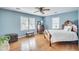Airy primary bedroom with hardwood floors, ceiling fan, and lots of natural light at 710 S Magnolia St, Summerville, SC 29483