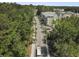 Aerial view of the neighborhood showcasing the condo buildings surrounded by lush greenery and streets at 7101 Bowen Corner Ave, Hanahan, SC 29410