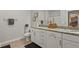 Neutral bathroom featuring double sinks with granite countertop and storage space at 7101 Bowen Corner Ave, Hanahan, SC 29410