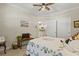 Bedroom with neutral walls, ceiling fan, and a view into the kitchen at 7101 Bowen Corner Ave, Hanahan, SC 29410