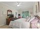 Relaxing bedroom with large window and ceiling fan providing a comfortable space at 7101 Bowen Corner Ave, Hanahan, SC 29410