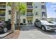 Multi-level condo building with reserved parking and palm trees accenting the facade at 7101 Bowen Corner Ave, Hanahan, SC 29410