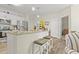 Stylish kitchen featuring stainless steel appliances, a granite island, and white cabinetry at 7101 Bowen Corner Ave, Hanahan, SC 29410