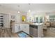 Open-concept kitchen boasts granite countertops and modern stainless steel dishwasher at 7101 Bowen Corner Ave, Hanahan, SC 29410