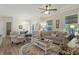 Bright living room with lots of seating, a ceiling fan, and natural light at 7101 Bowen Corner Ave, Hanahan, SC 29410
